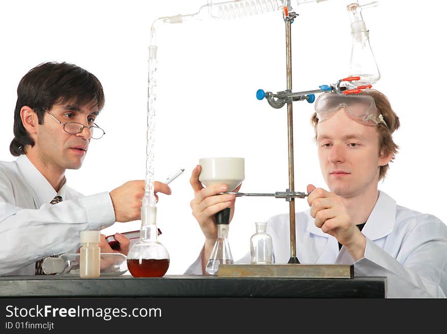 Two chemists with chemical equipment