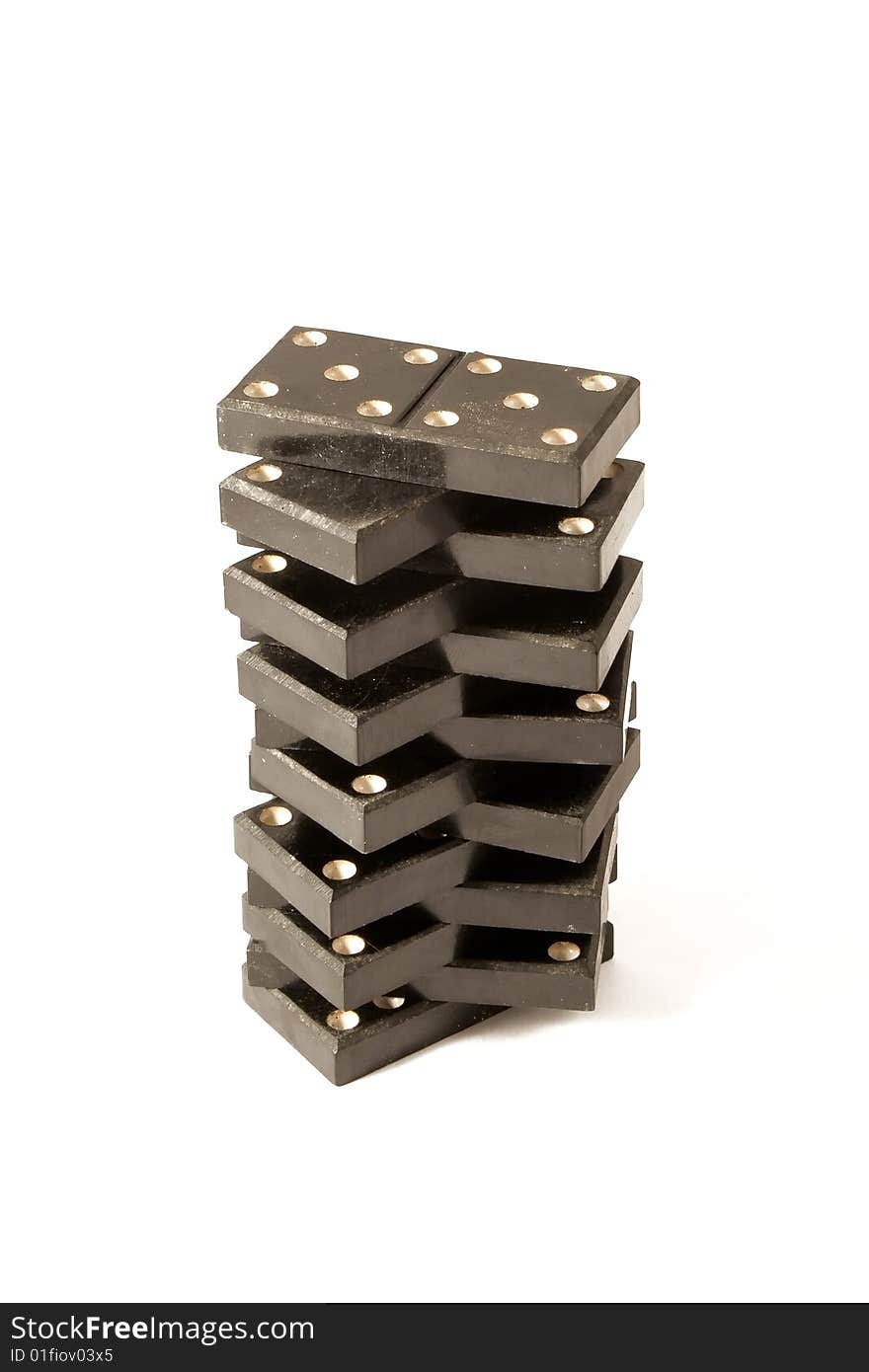 Tower from dominoes on a white background