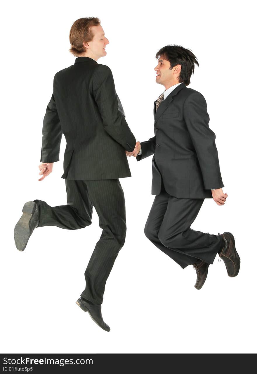 Two businessmen jump