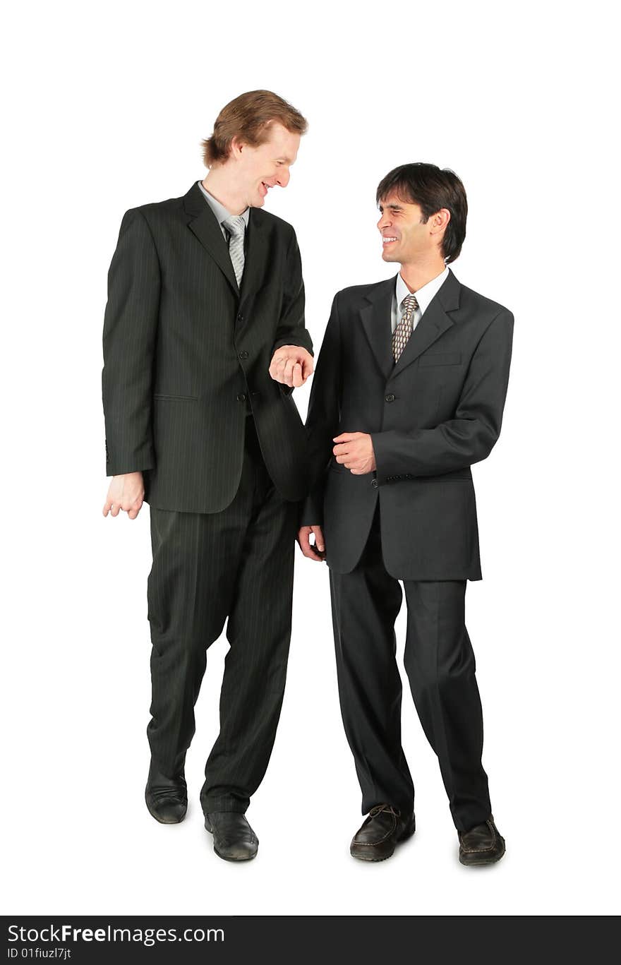 Two friendly businessmen walking on white background