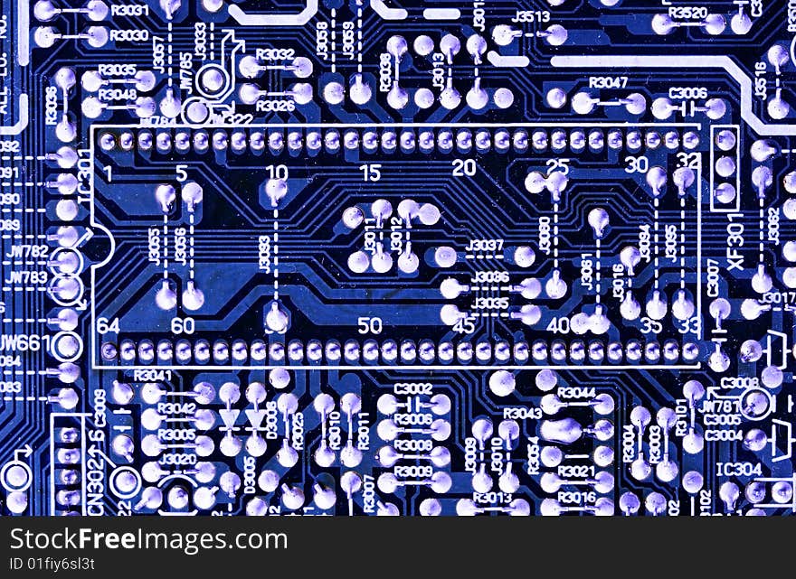 Close-up of microcircuit board. Old an dirty. Texture. Deep blue color.