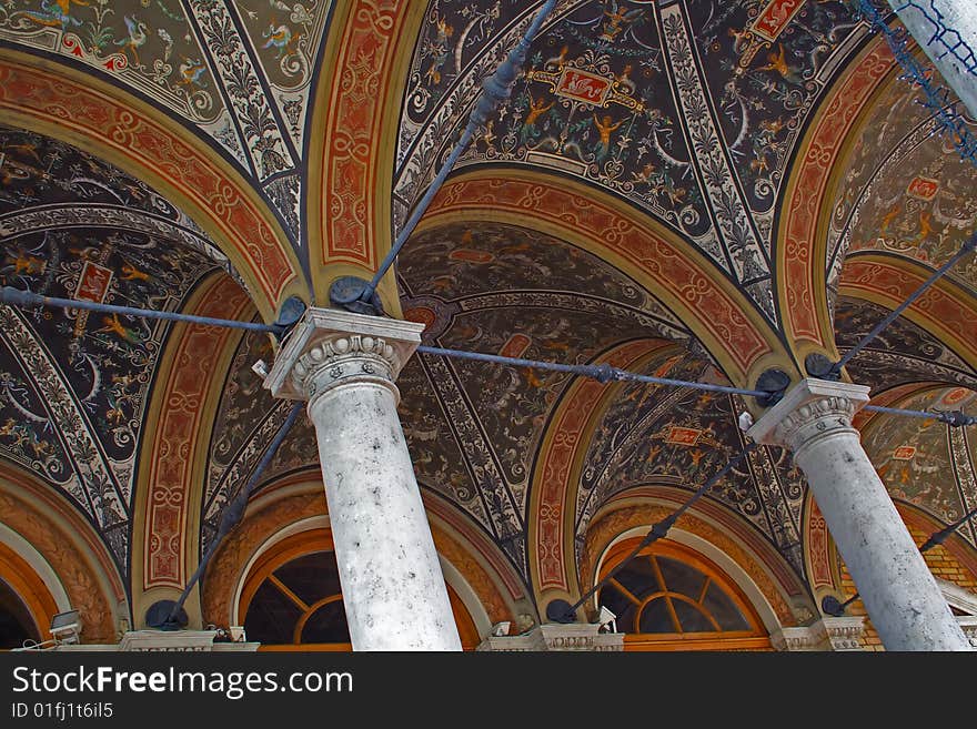 White columns over painted ceiling with fine details. White columns over painted ceiling with fine details