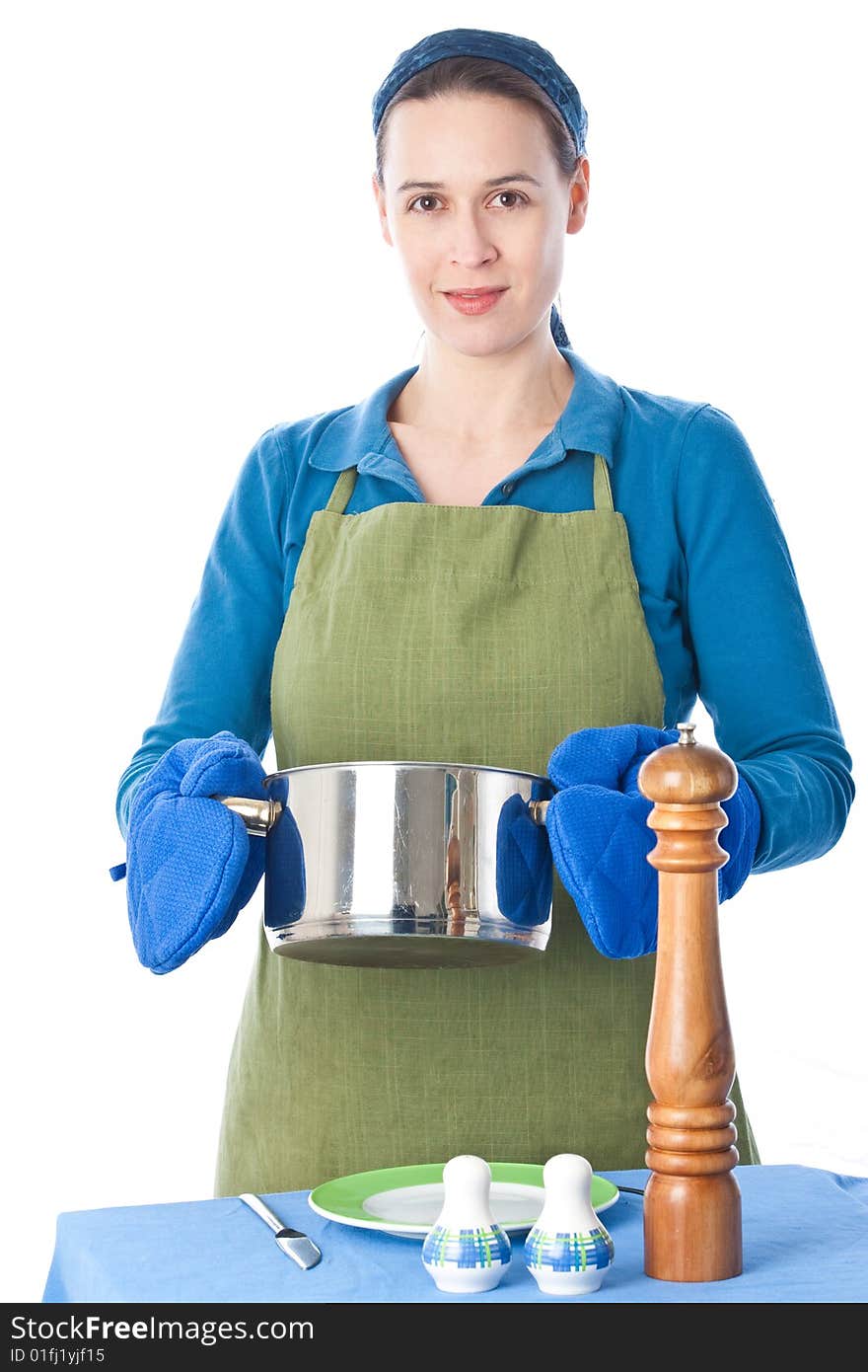 A woman in a domestic role preparing food on white. A woman in a domestic role preparing food on white.