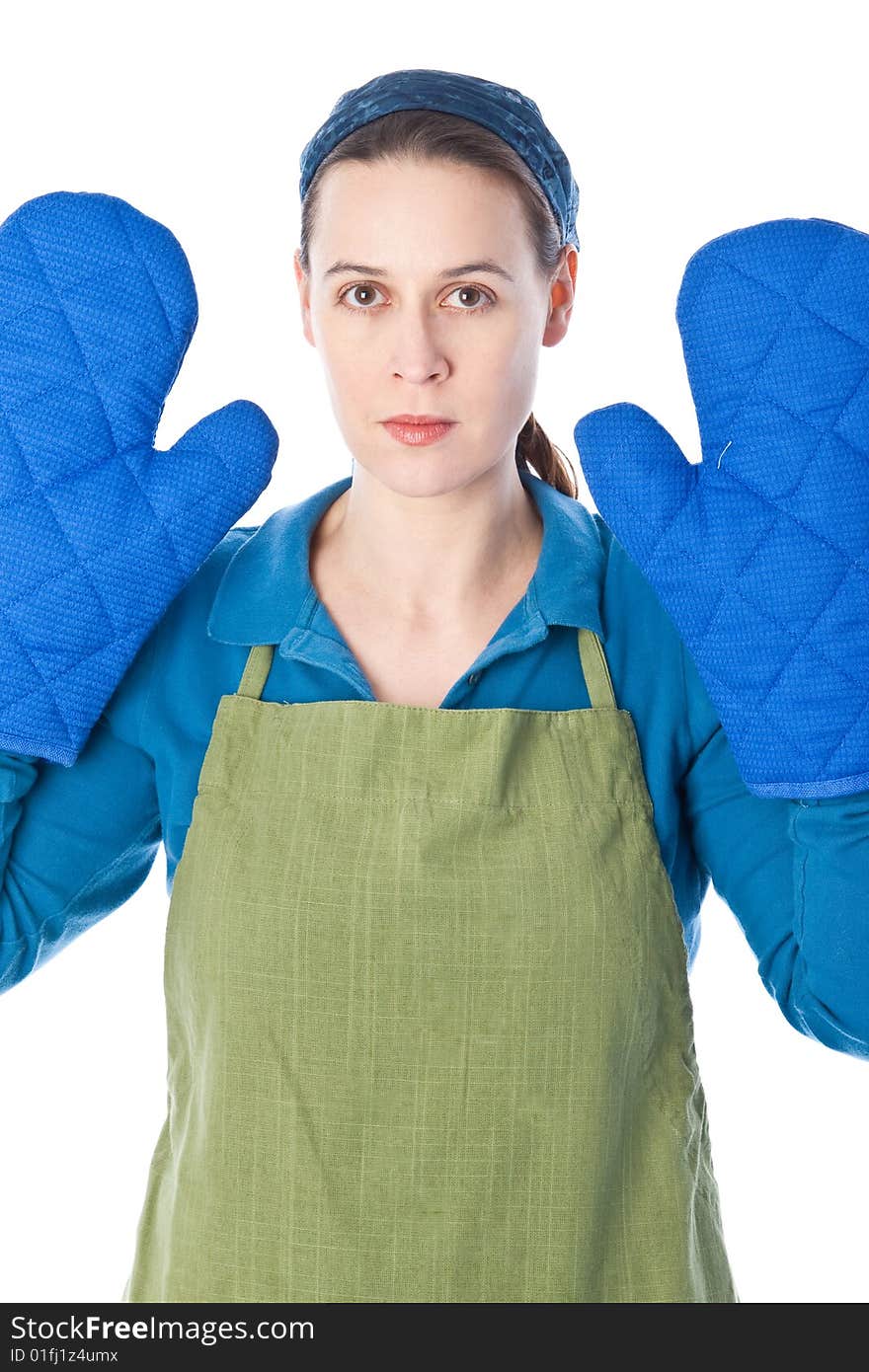 A woman in a domesatic role with oven gloves - on white. A woman in a domesatic role with oven gloves - on white