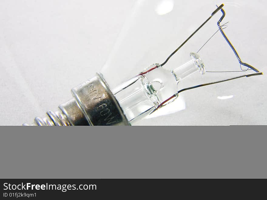 Closeup of light bulb on white background