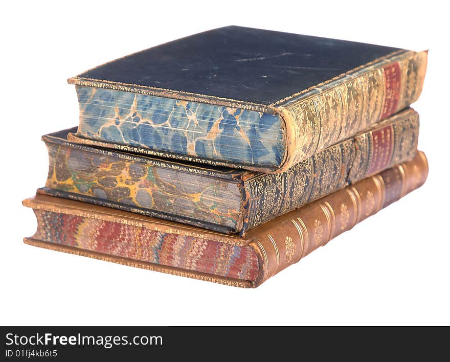 A pile of old leather bound books isolated on a white background