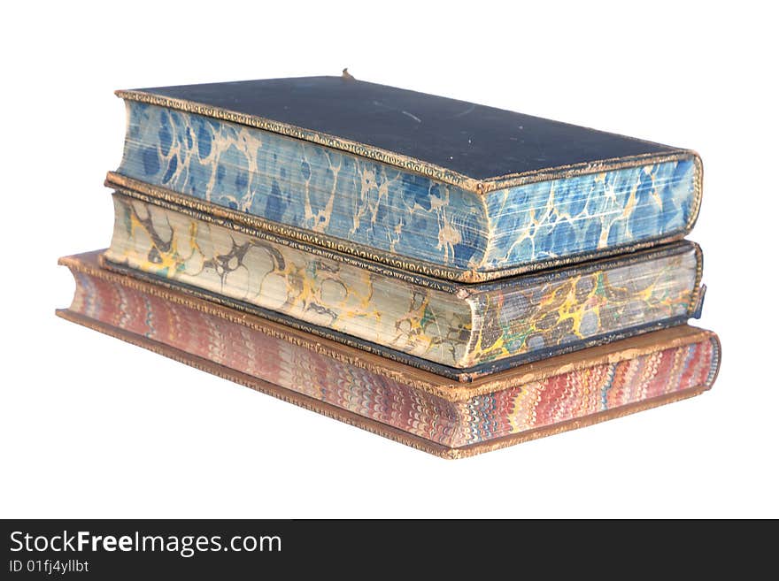 A pile of old leather bound books isolated on a white background