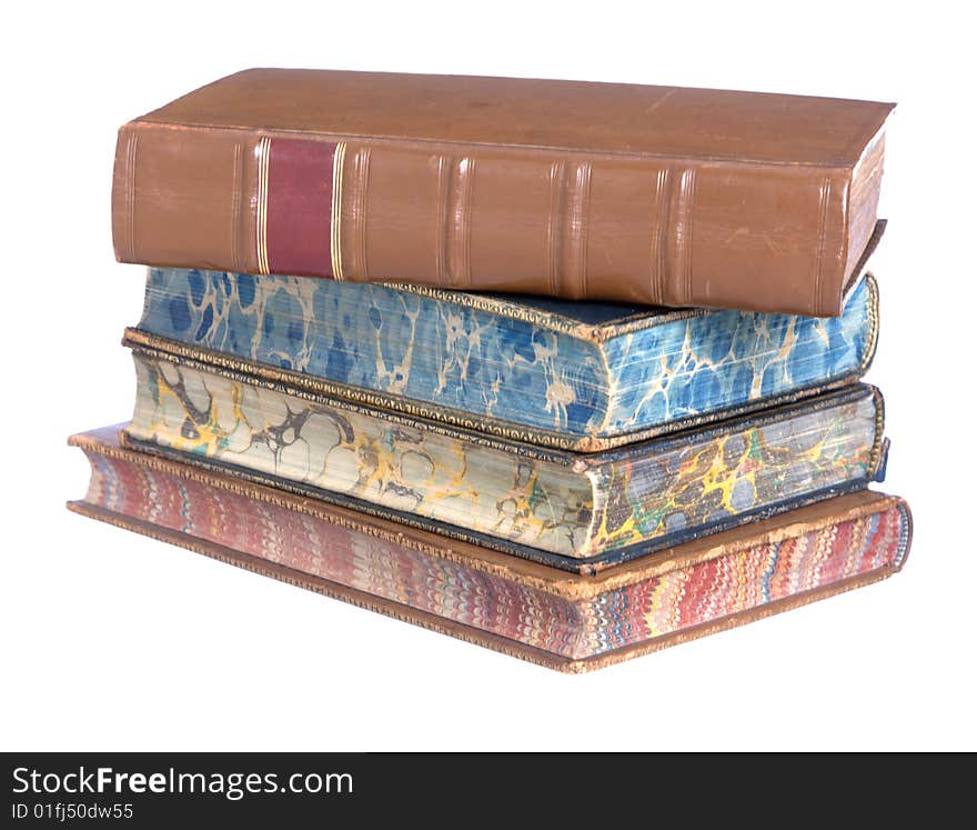 A pile of old leather bound books isolated on a white background