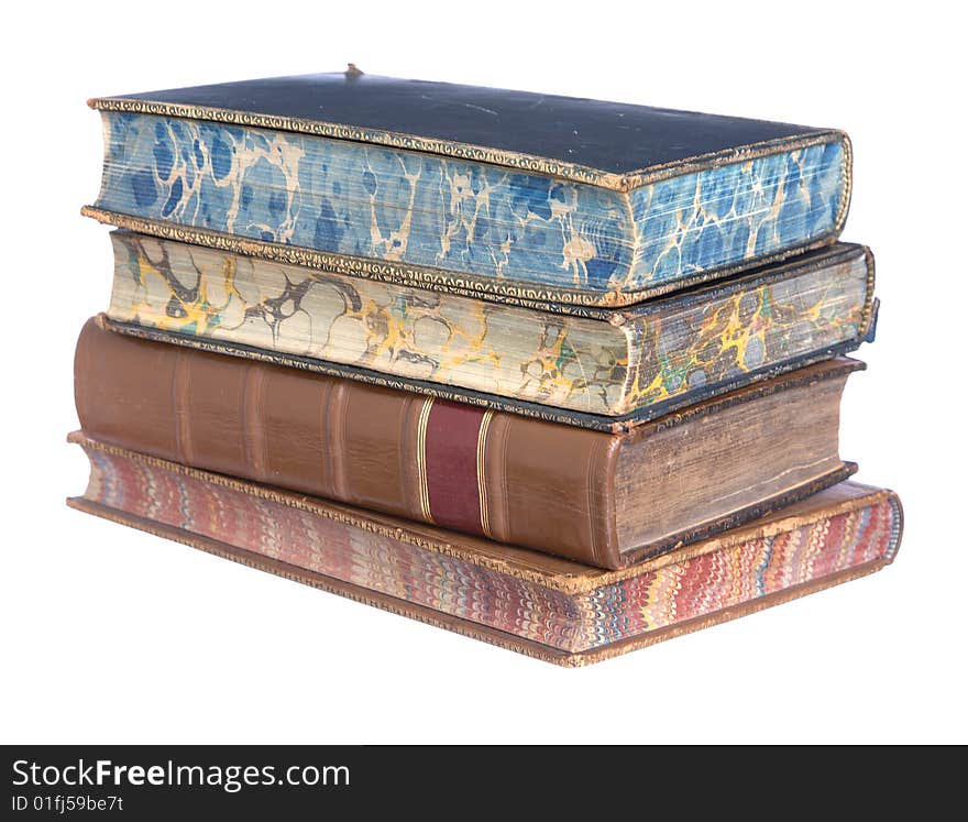 A pile of old leather bound books isolated on a white background