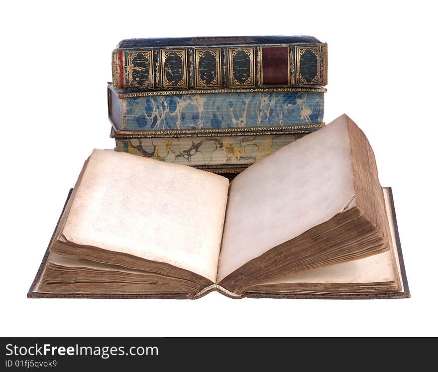 A pile of old leather bound books isolated on a white background