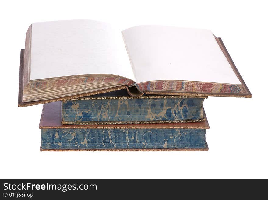 A pile of old leather bound books isolated on a white background