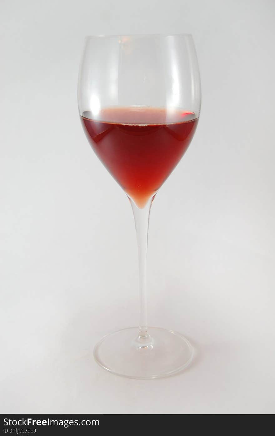 One glass with red wine