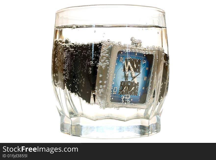 Waterproof watch in glass with water.