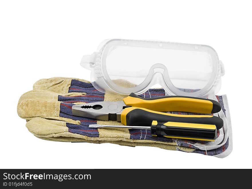 Construction tools,protective glasses and gloves,pliers and screwdriver isolated on white background.Also,check out Workers and tools