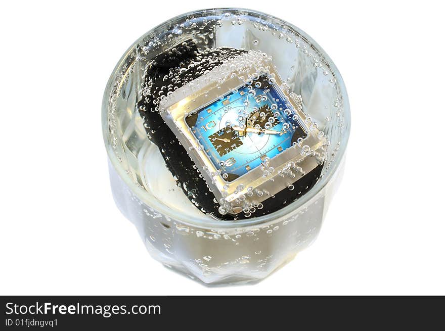 Waterproof watch in glass with water.