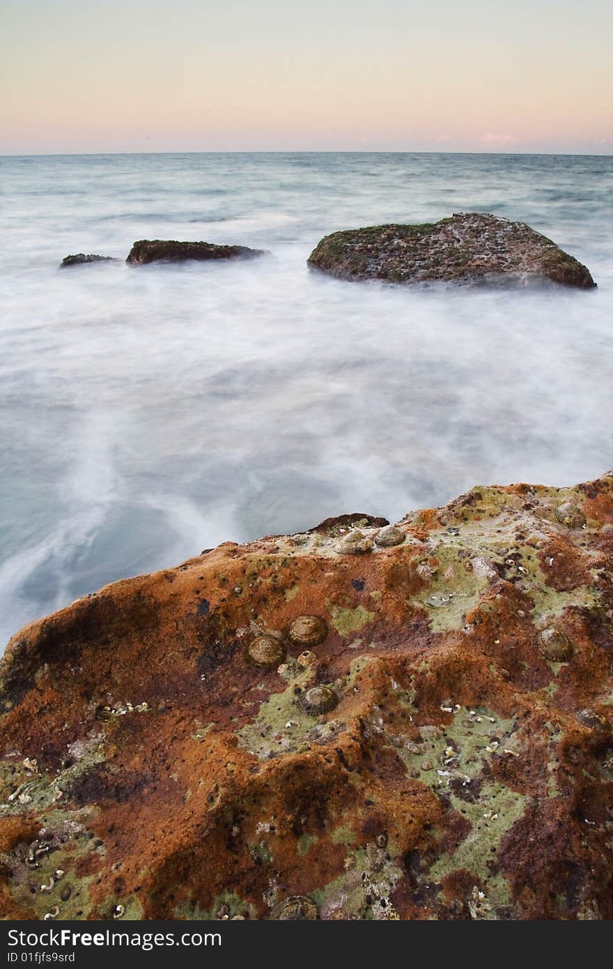 Taken in Anna Bay, NSW, Australia in early morning twilight conditions. Blured misty water effect due to long shutter speed. Taken in Anna Bay, NSW, Australia in early morning twilight conditions. Blured misty water effect due to long shutter speed.