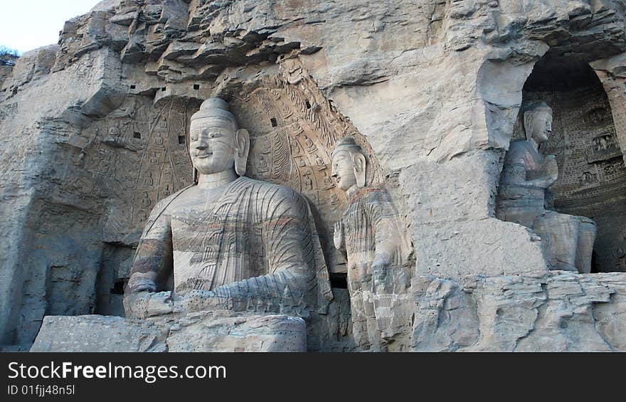 The Yungang Grottoes are ancient Buddhist temple grottoes near the city of Datong in the Chinese province of Shanxi. They are excellent examples of rock-cut architecture and one of the three most famous ancient sculptural sites of China. . The Yungang Grottoes are ancient Buddhist temple grottoes near the city of Datong in the Chinese province of Shanxi. They are excellent examples of rock-cut architecture and one of the three most famous ancient sculptural sites of China.