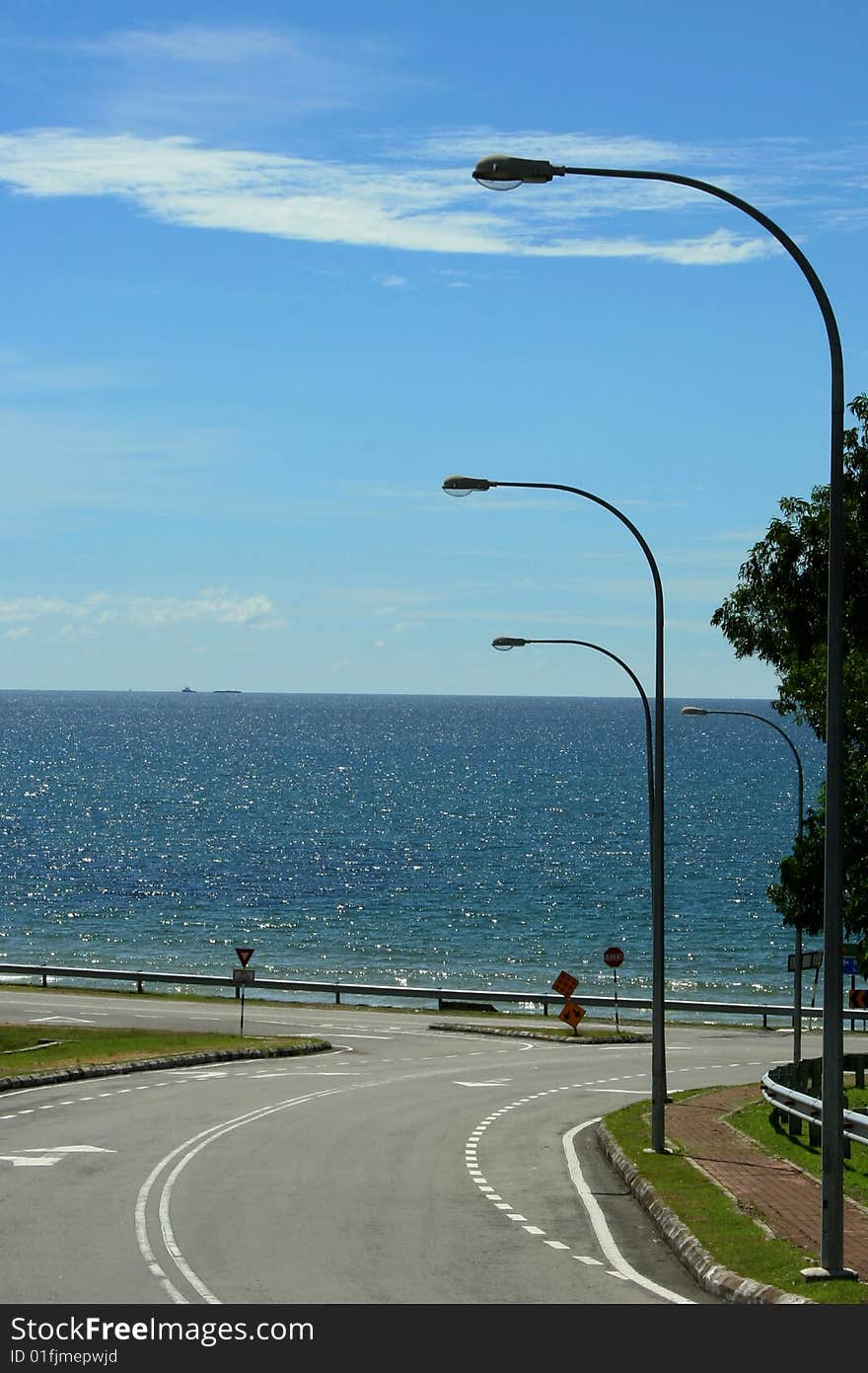 A road from University Malaysia Sabah toward the ocean. A road from University Malaysia Sabah toward the ocean.