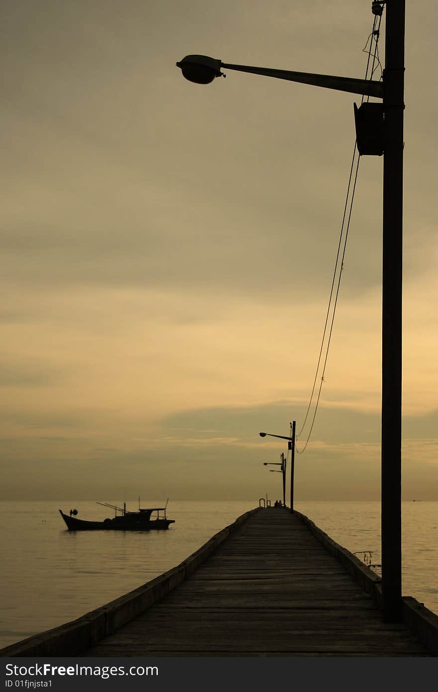 A jetty equipped with a row of lamp post to assist the fishermen at night. A jetty equipped with a row of lamp post to assist the fishermen at night.