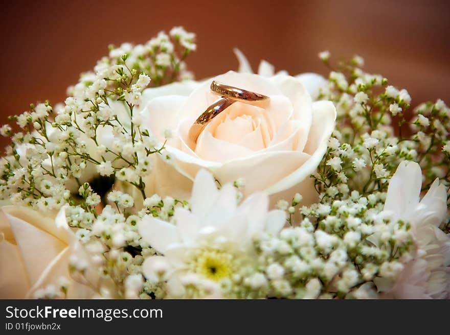 Wedding rings in a bouquet of the bride