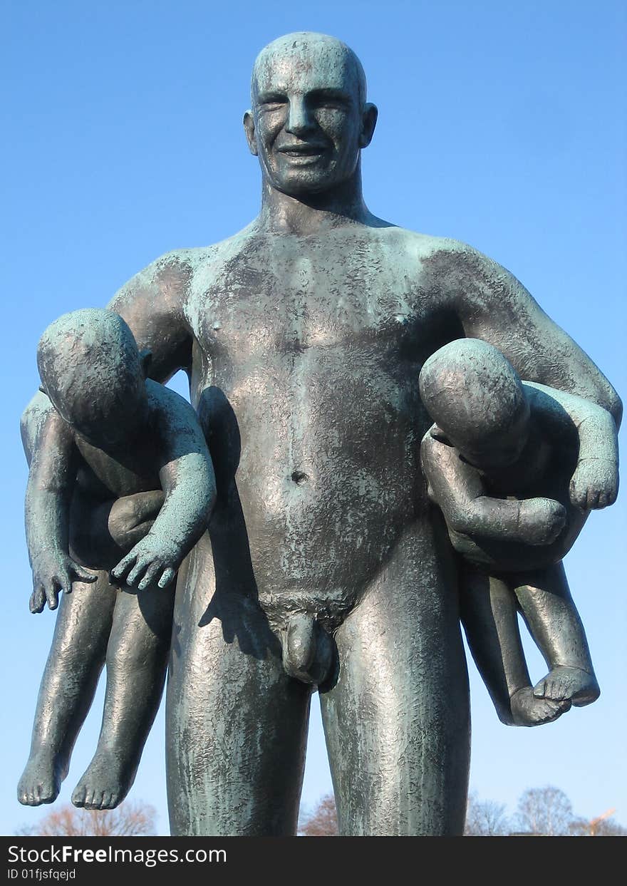 Sculpure of man with kids, Vigeland sculpture park Oslo, Norway.