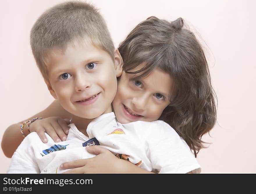 Studio portrait of  two little kids having good time. Studio portrait of  two little kids having good time