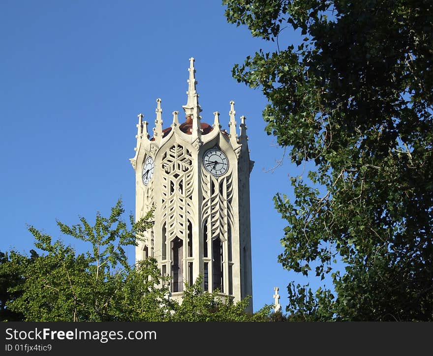 Scenic photo of a Gothic clock tower building somewhere in New zealand