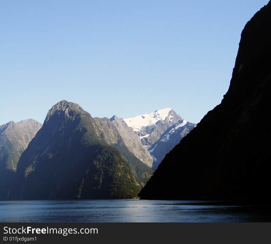 Scenic photo of lake mountains in the background somewhere in New Zealand. Scenic photo of lake mountains in the background somewhere in New Zealand