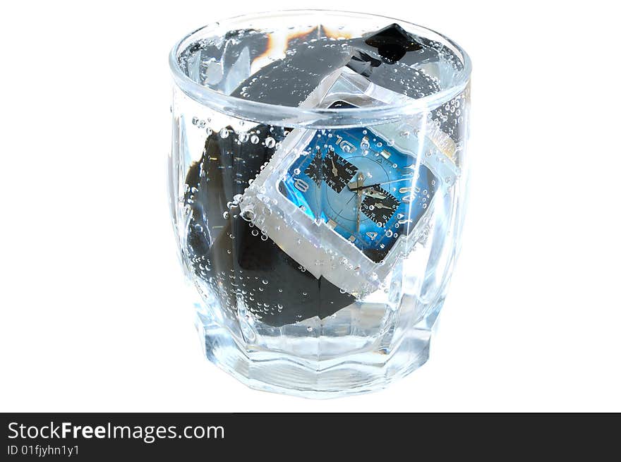 Waterproof watch in glass with water.