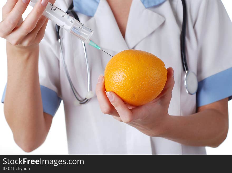 Nurse with syringe make injection in orange