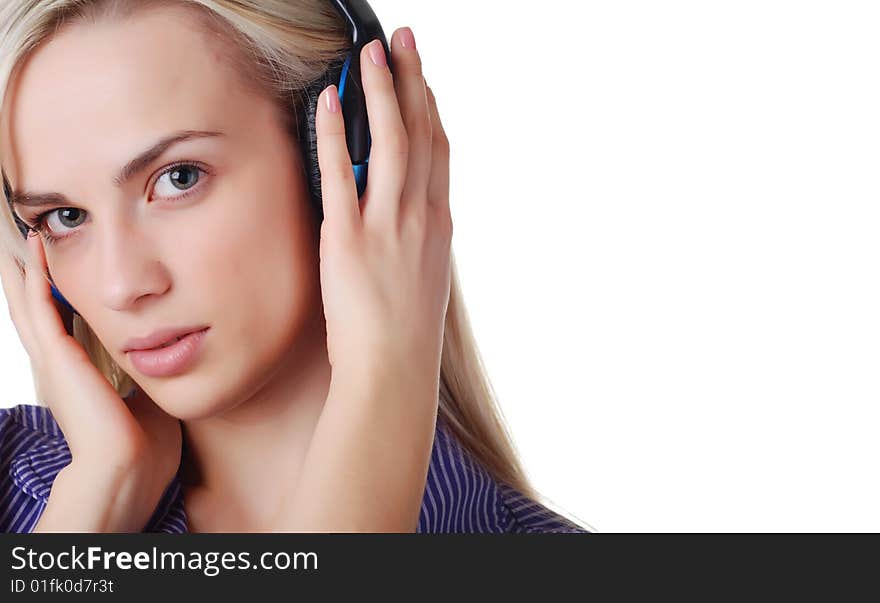 Young beautiful woman listening music with headpfones. Young beautiful woman listening music with headpfones