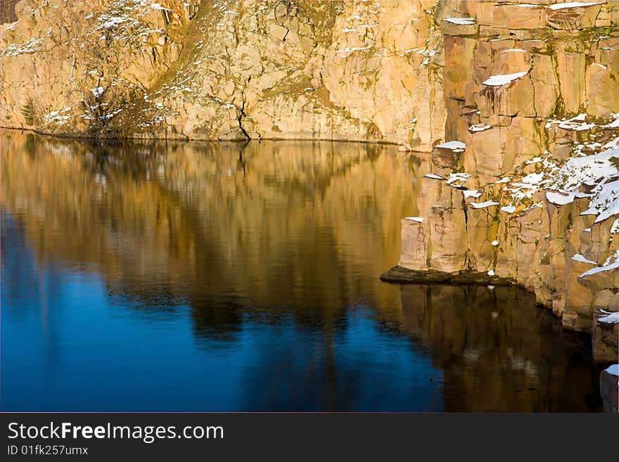 Rock and their reflection in the water in winter setting (Sweden). Rock and their reflection in the water in winter setting (Sweden)