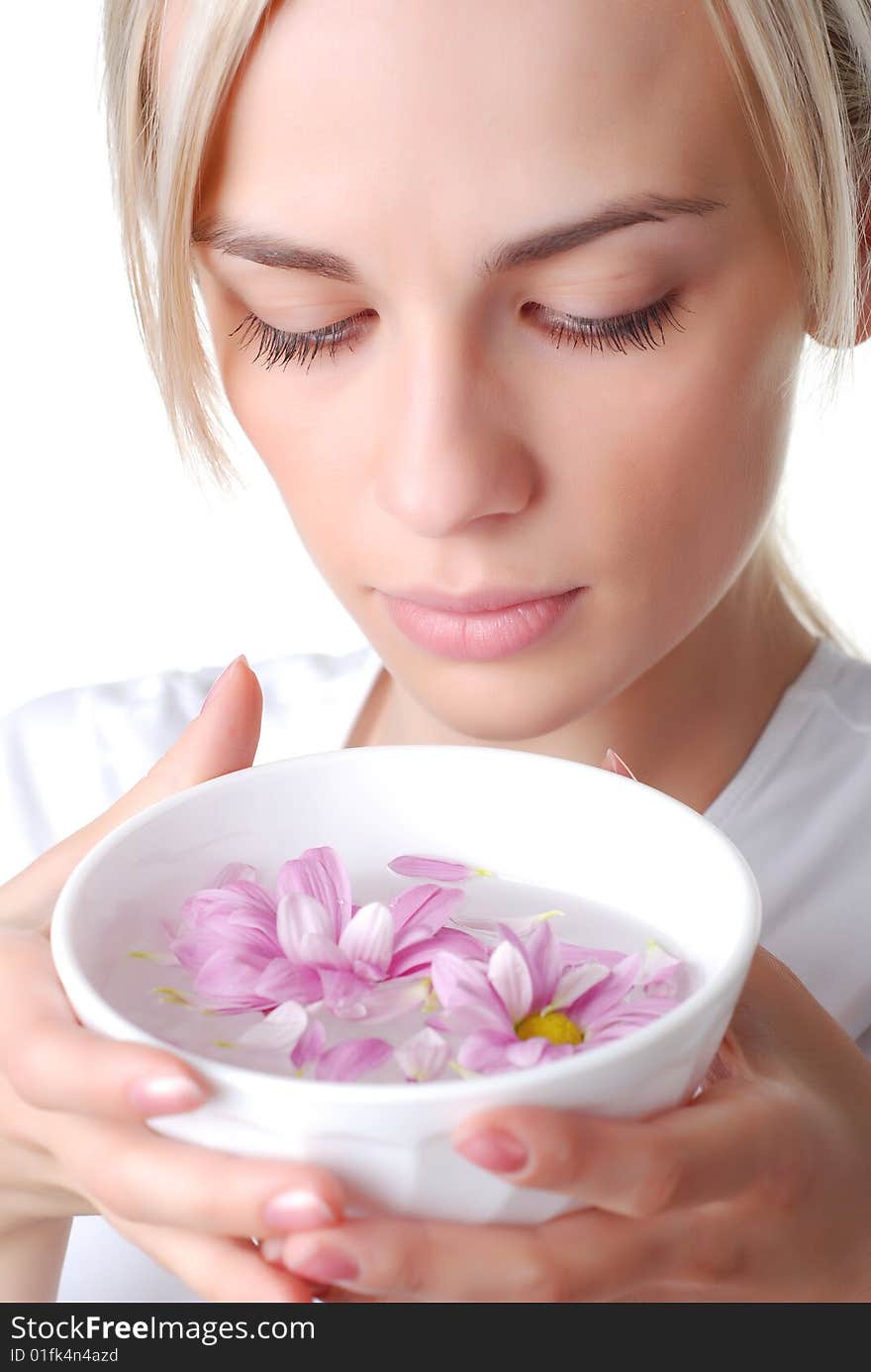 Beautiful blond woman with bowl of flowers. Beautiful blond woman with bowl of flowers