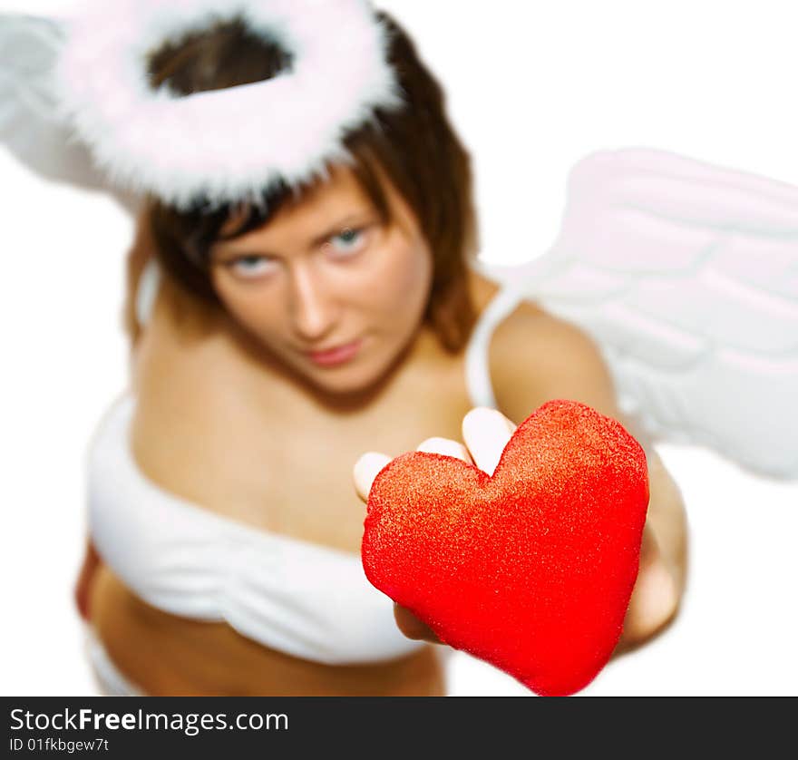 Young woman in angel's costume with red heart