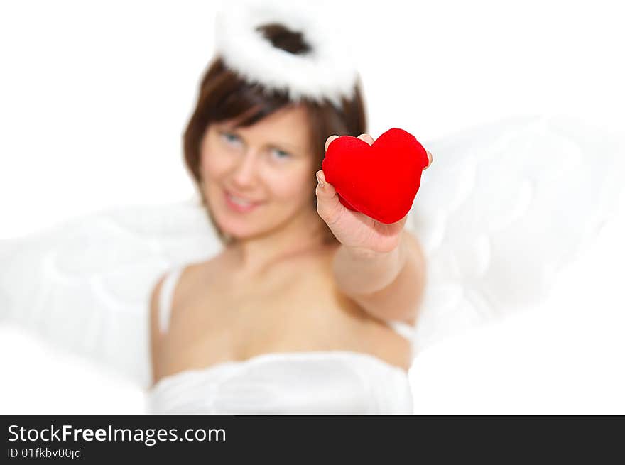 Young woman in angel's costume with red heart, isolated on white