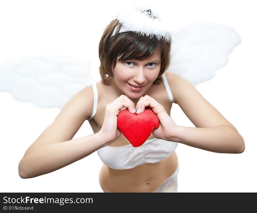 Young woman in angel's costume with red heart, isolated on white