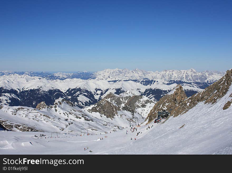 Austria. Mountains. The Alpes.Tops of mountains in a snow and the bright dark blue sky.