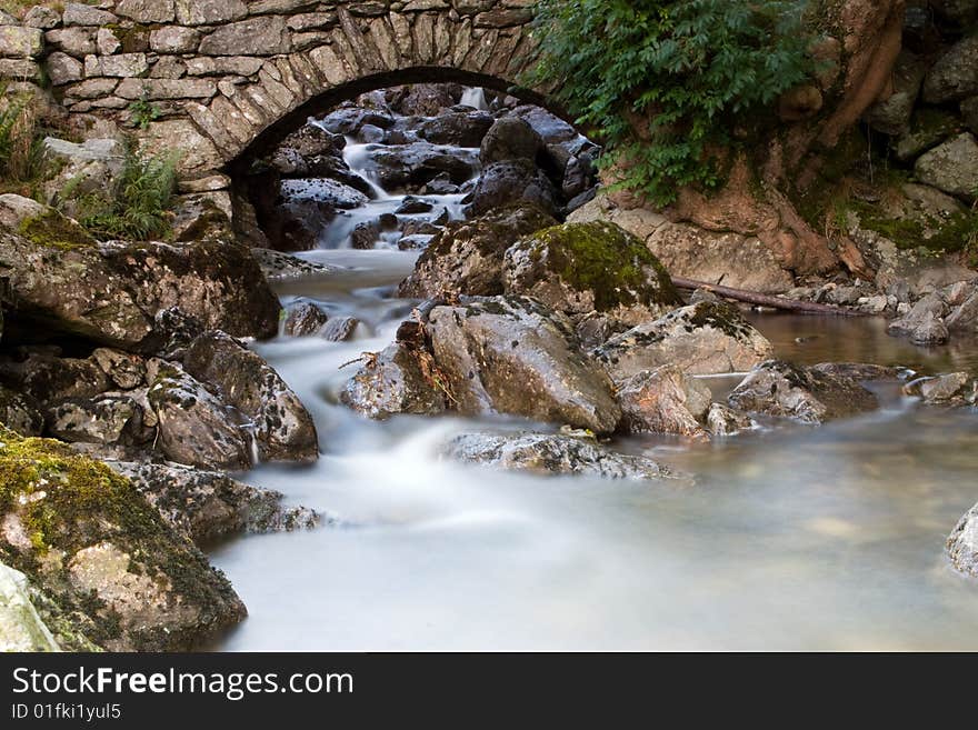 The bridge and the small waterfall