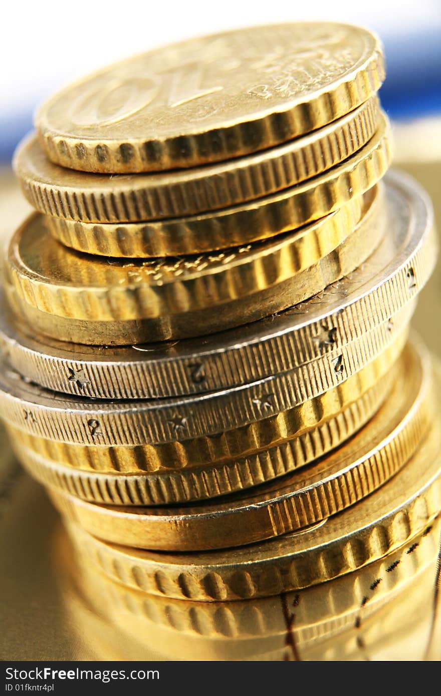 Pile of euro coins on golden background. Pile of euro coins on golden background.