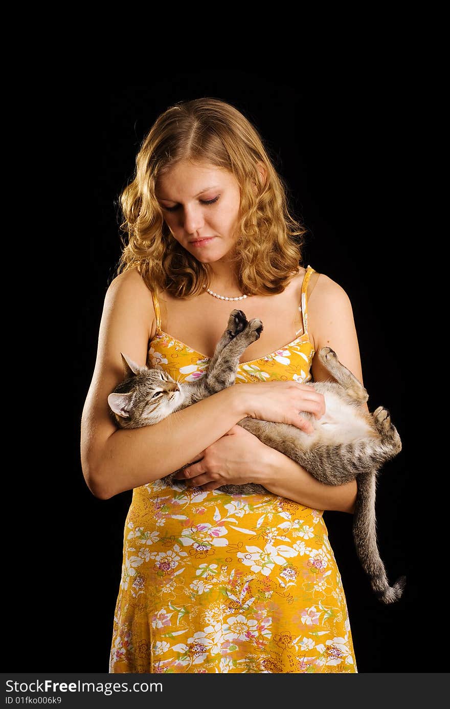 Cat and cute girl in orange dress. Cat and cute girl in orange dress