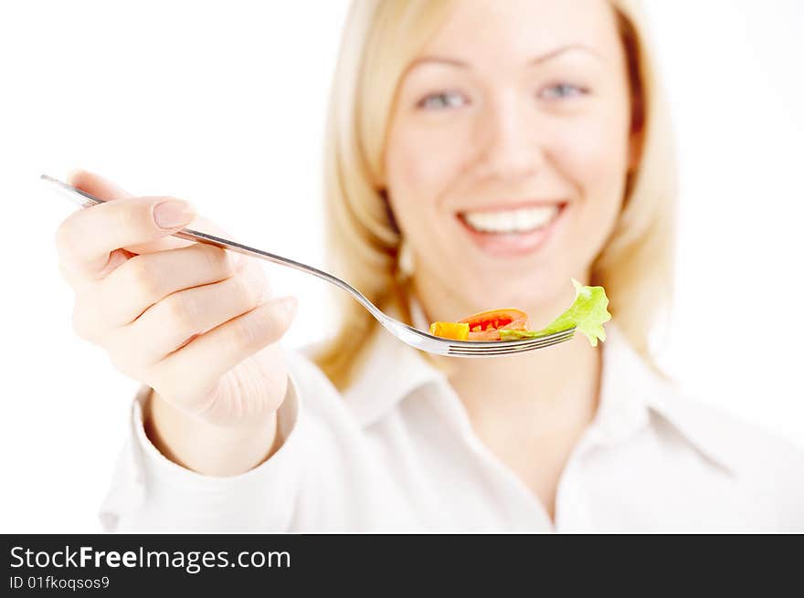 The smiling blonde holds a plug with the salad, isolated. The smiling blonde holds a plug with the salad, isolated