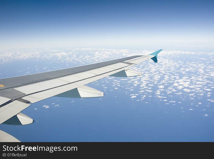 An aerial view of the ocean and clouds