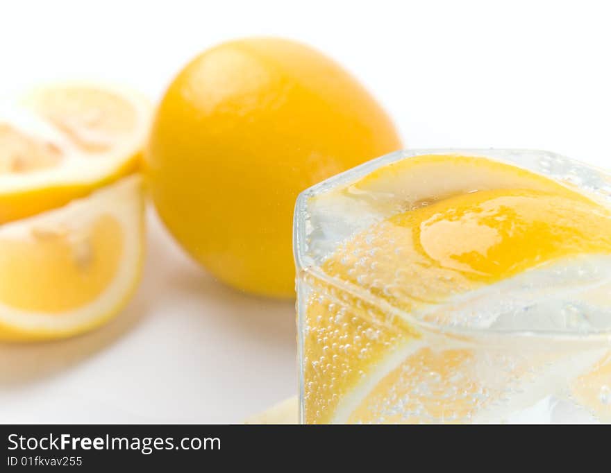 Glass with soda water and lemon slices