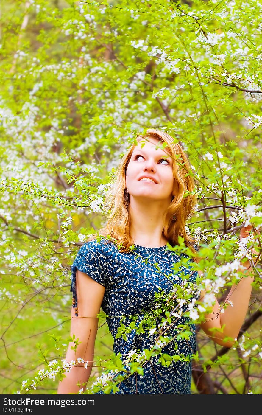 Young  Woman And Flowered Tree