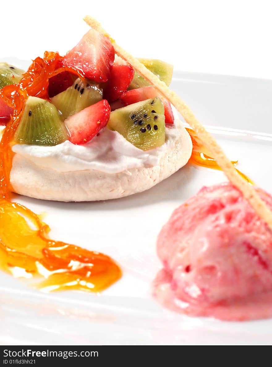 Meringue with Cream and Fresh Berries and Fruit with Strawberry Sorbet. Isolated on White Background. Meringue with Cream and Fresh Berries and Fruit with Strawberry Sorbet. Isolated on White Background