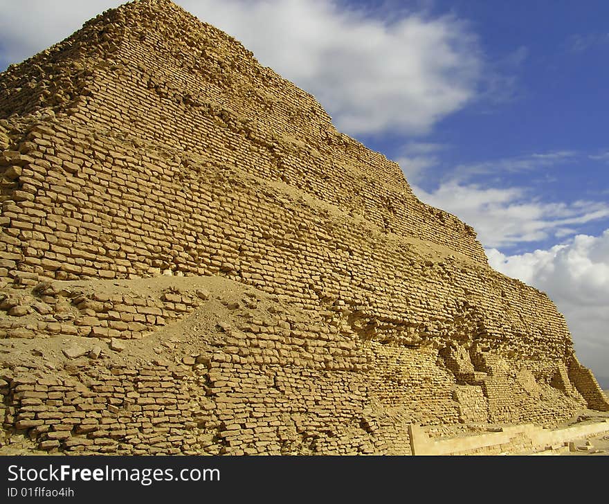 This pyramid is the first one ever build so it's the oldest one. Compared to the most famous Giza pyramids, this one is made out of brick instead of blocks of stone (you can see that it's falling apart quite a bit) and its wall consists of 6 steps instead of being one smooth area. This pyramid is the first one ever build so it's the oldest one. Compared to the most famous Giza pyramids, this one is made out of brick instead of blocks of stone (you can see that it's falling apart quite a bit) and its wall consists of 6 steps instead of being one smooth area.