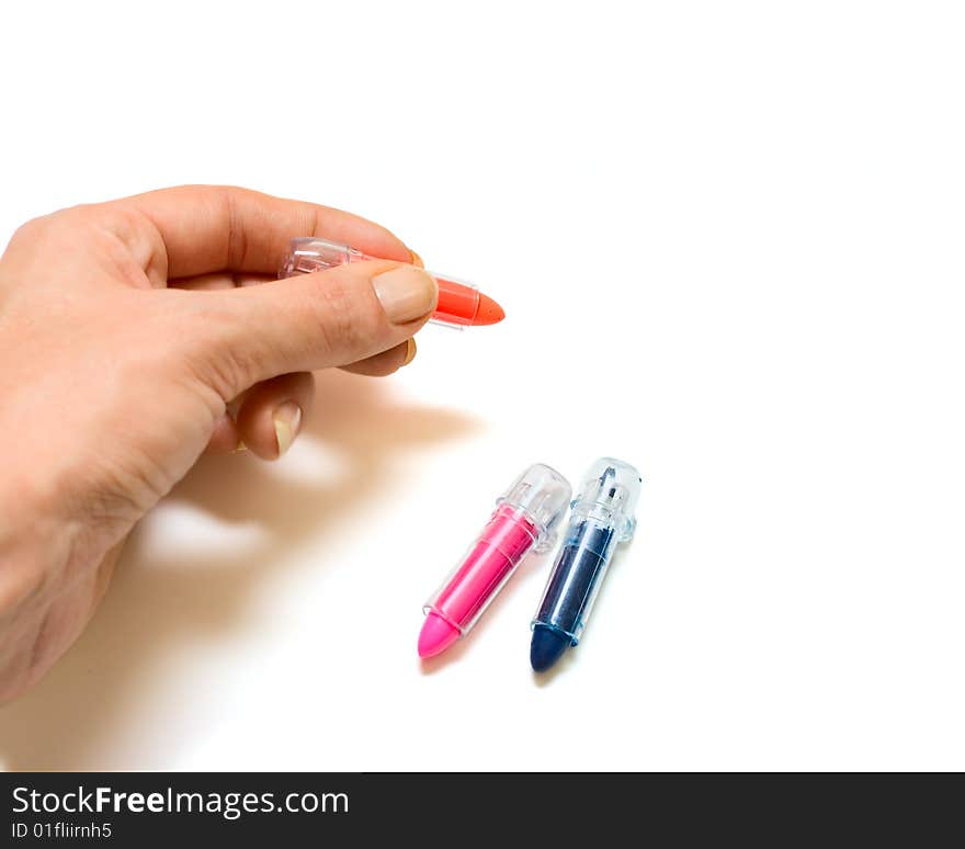 Human hand with color chalk isolated on white