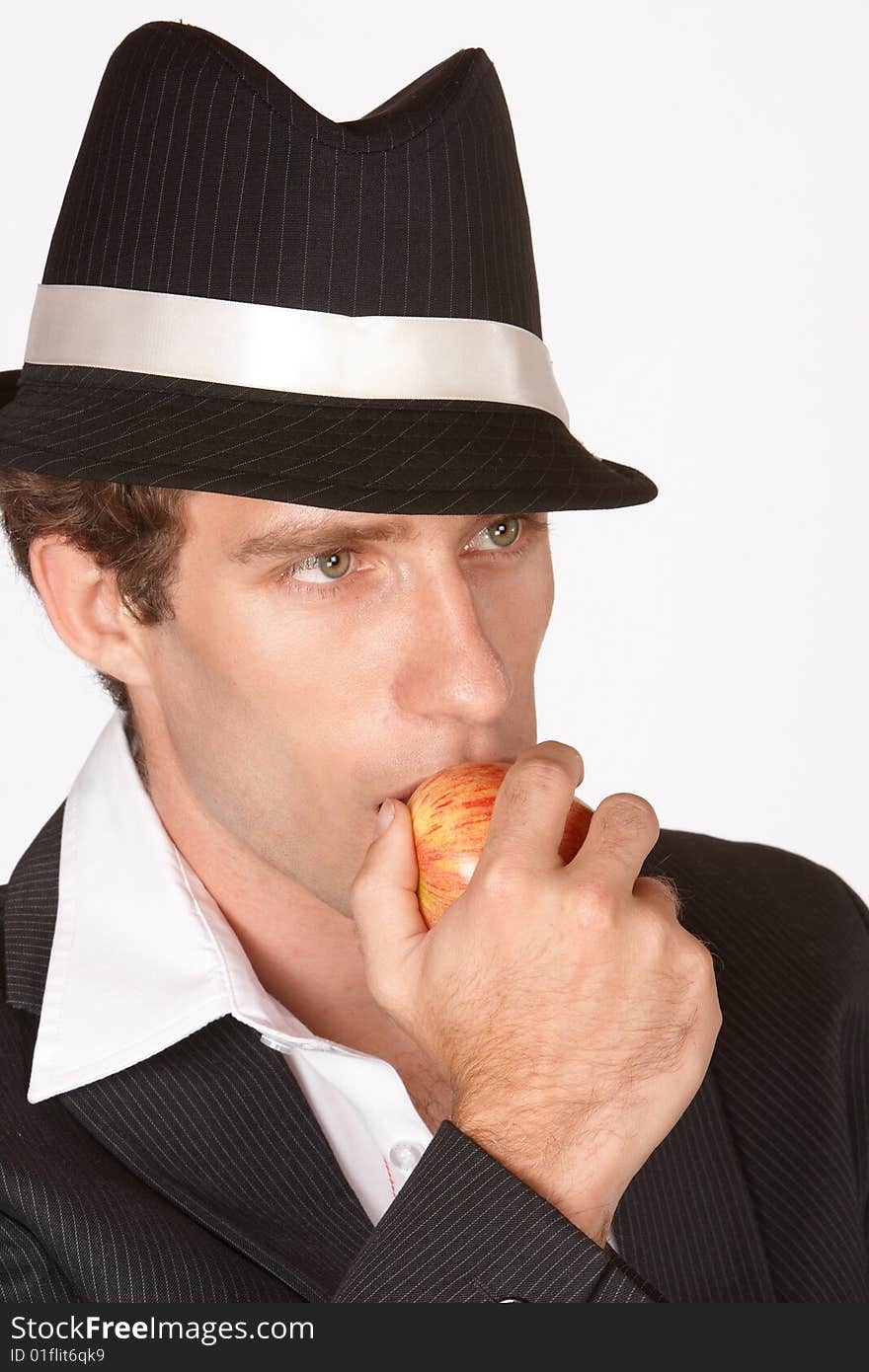 Man biting into delicious apple while looking serious. Man biting into delicious apple while looking serious