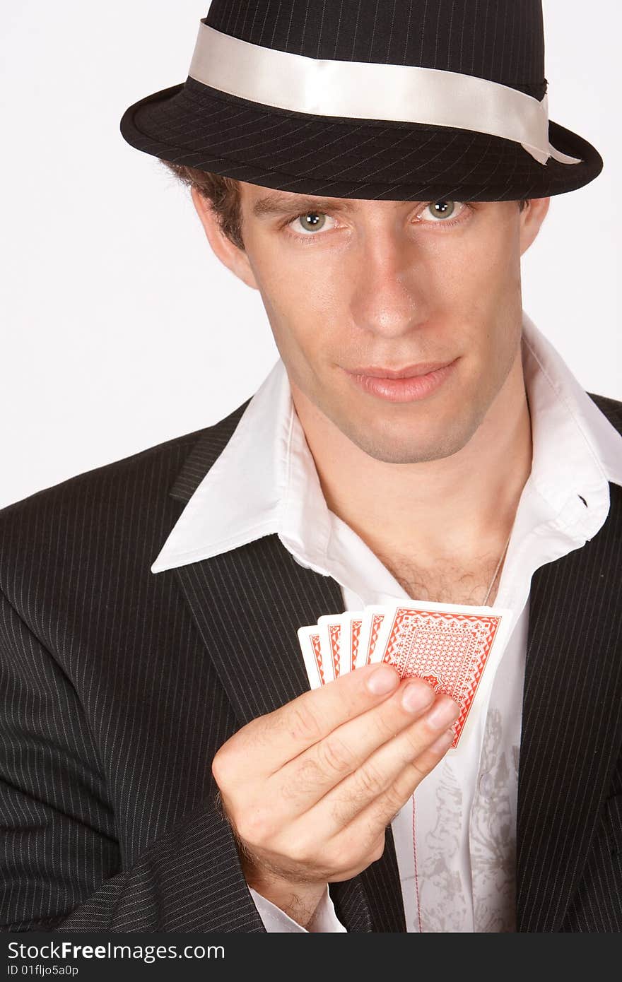 Poker player with cards in hand looking up