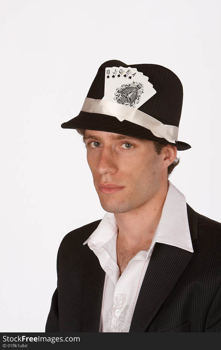 Portrait of poker player with royal flush in hat